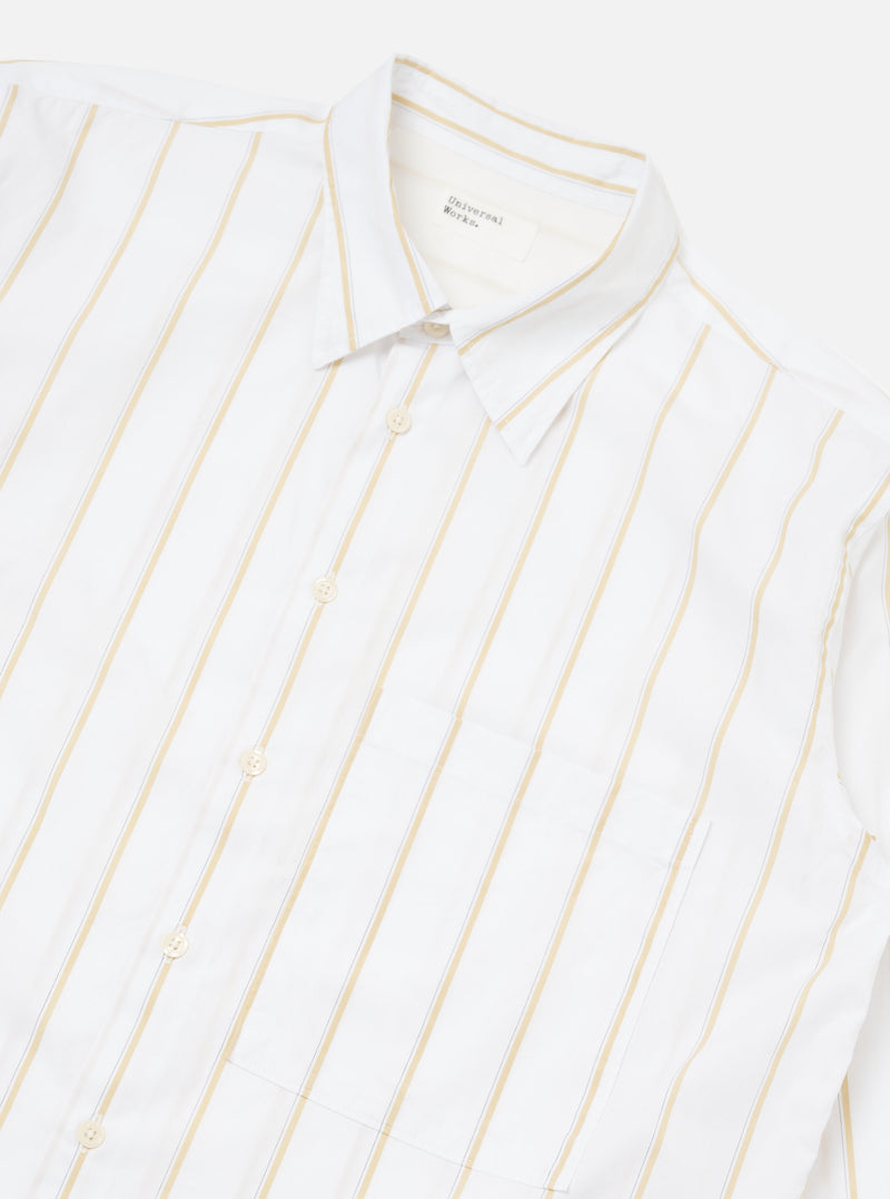 Close-up of the White Office Stripe Square Pocket Shirt on a white surface. The shirt is white with yellow stripes and has a square pocket.