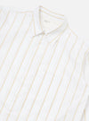 Close-up of the White Office Stripe Square Pocket Shirt on a white surface. The shirt is white with yellow stripes and has a square pocket.
