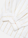 Close-up of the White Office Stripe Square Pocket Shirt on a white surface. The shirt has gold and blue stripes and white buttons.