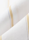 Close-up of the White Office Stripe Square Pocket Shirt fabric. Features white material with gold and blue stripes. The shirt is folded on a white surface.