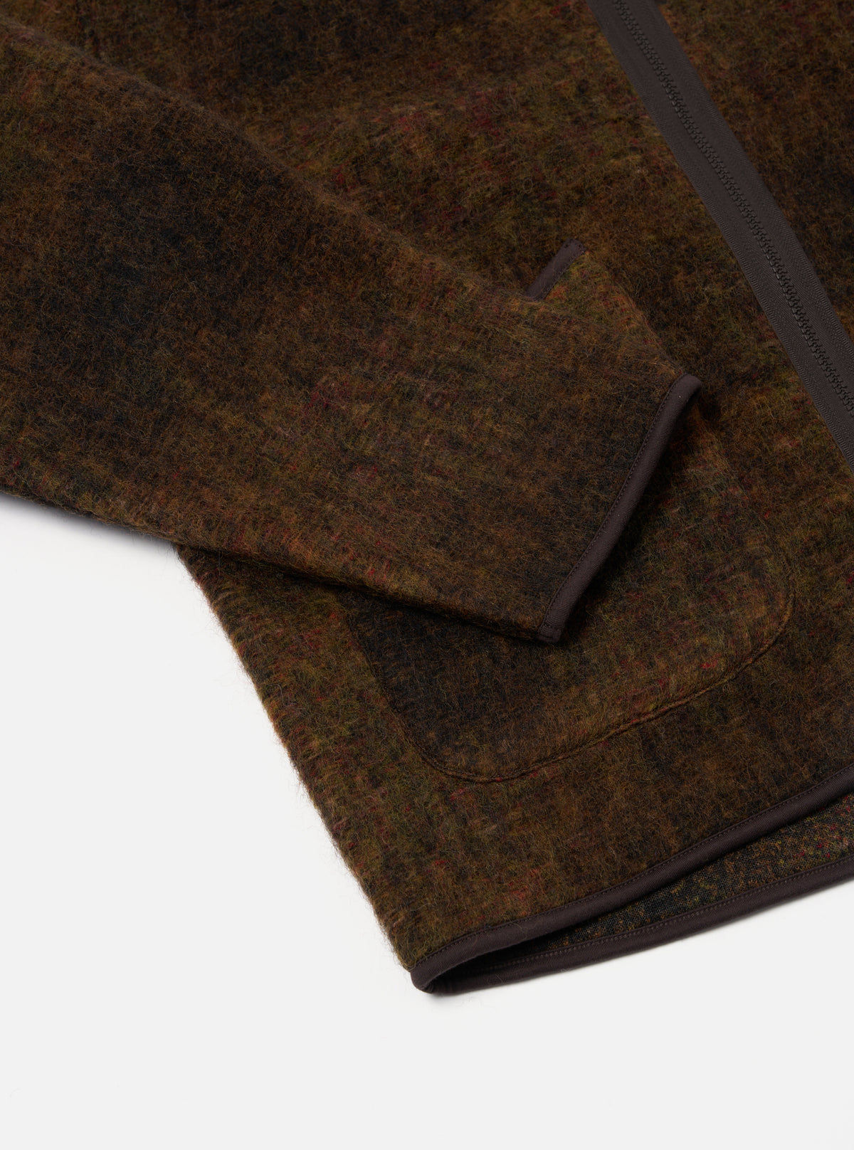 Close-up of the Brown Alps Fleece Zip Liner Jacket on a white background. The brown fleece material is visible, along with the zipper and pocket trim.