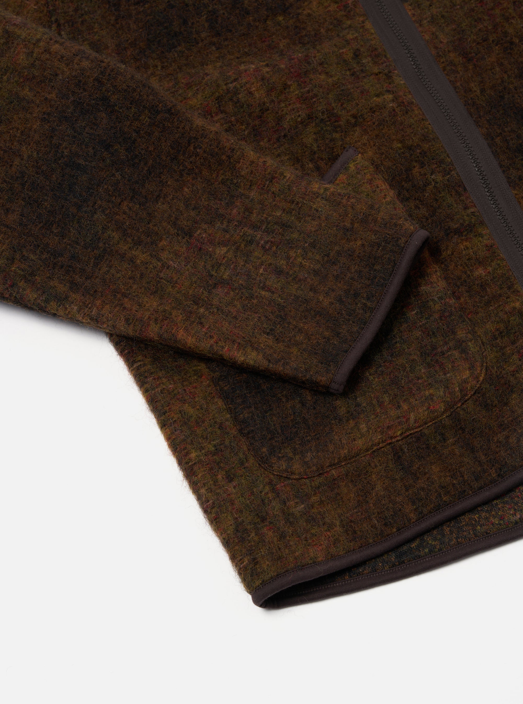 Close-up of the Brown Alps Fleece Zip Liner Jacket on a white background. The brown fleece material is visible, along with the zipper and pocket trim.