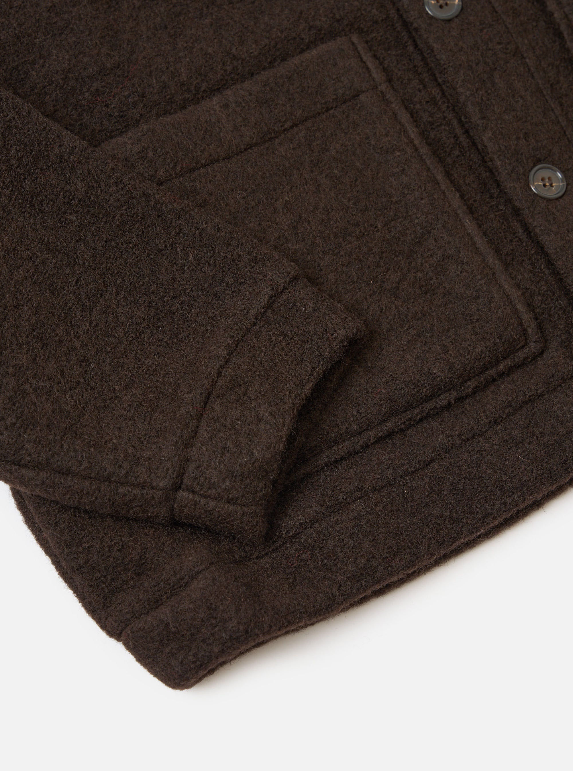Close-up of the Brown Wool Fleece Advance Cardigan on a white background, showing the texture and details of the wool fleece material and button.