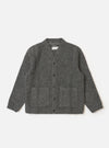 The Grey Marl Wool Fleece Advance Cardigan in grey on a white background. The wool cardigan has a v-neck, button closure, and two front pockets.