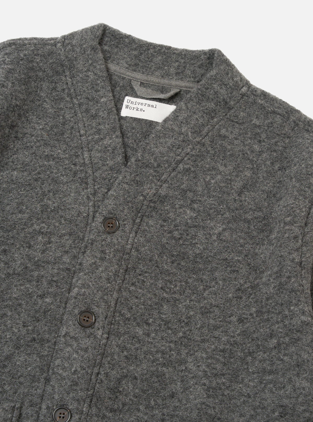 Close-up of the Grey Marl Wool Fleece Advance Cardigan on a white background. Shows the texture of the wool and the button detail.
