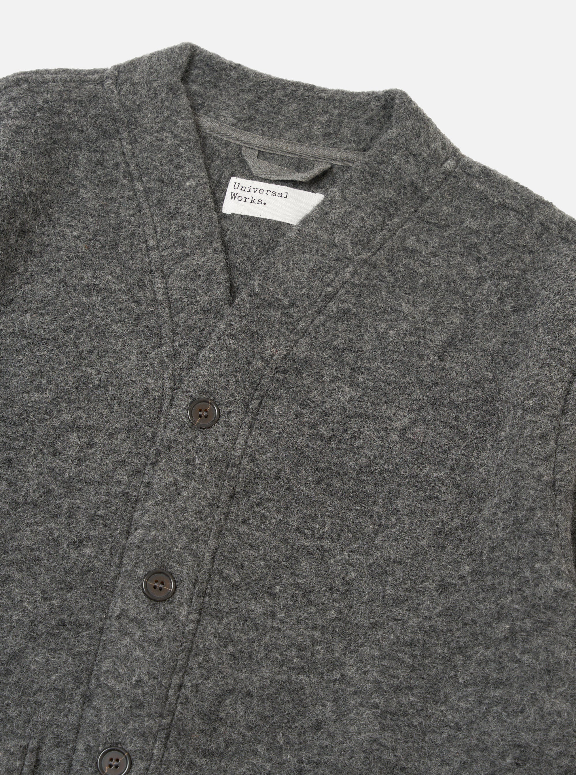 Close-up of the Grey Marl Wool Fleece Advance Cardigan on a white background. Shows the texture of the wool and the button detail.