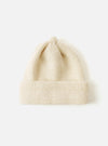 Close-up of an Ecru Alpaca/British Wool Bobble Hat on a white background. The knitted hat is soft and warm, perfect for winter.