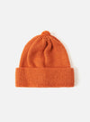 Close-up of an Orange Alpaca/British Wool Bobble Hat on a white background. The knitted hat has a folded brim and a bobble on top.