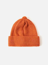 Close-up of an Orange Alpaca/British Wool Bobble Hat on a white background. The knitted hat has a folded brim and a bobble on top.
