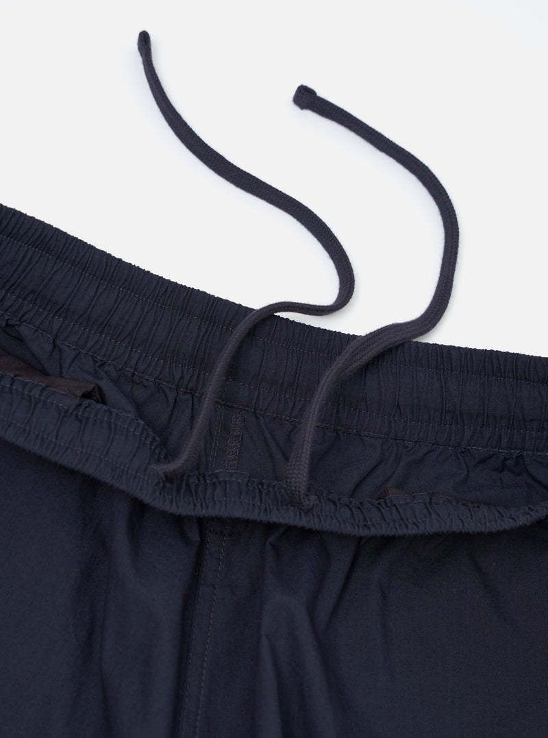A pair of navy paper touch cotton vacation shorts is shown from a rear perspective, laid flat against a plain white background. The image highlights the two rear patch pockets and the elasticated waistband of the dark blue garment.