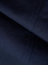 A close-up fabric swatch of the Navy Linen Slub Weave Manor Jacket shows a deep navy blue color and a textured slub weave. The fabric has a visible, irregular grain characteristic of linen.