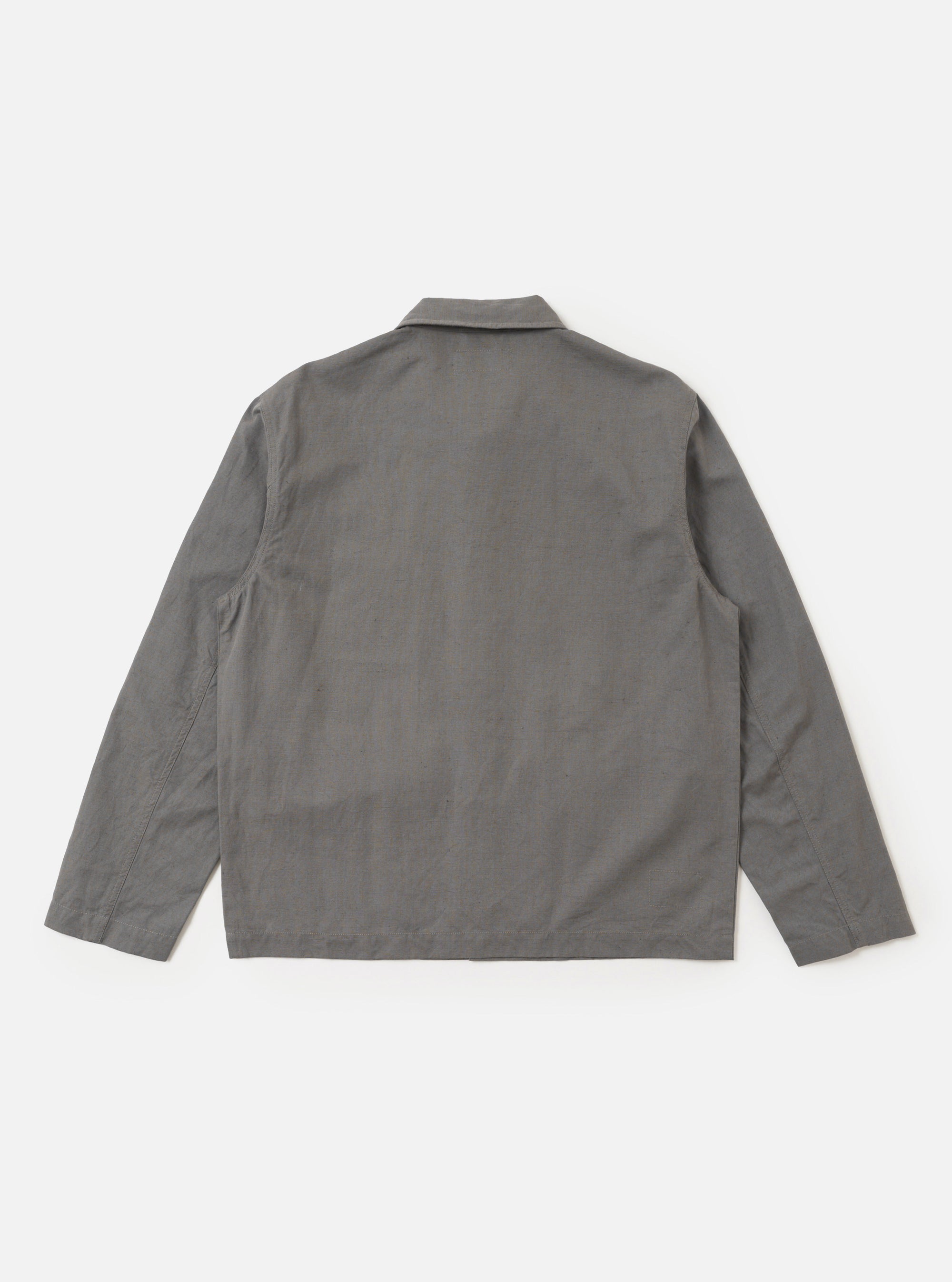 The Mid Grey Linen Slub Weave Franck Jacket is shown from the back as a flat lay against a plain white background. The image highlights the clean, simple construction of the garment's rear panel and the textured appearance of the mid-grey linen-cotton blend fabric.