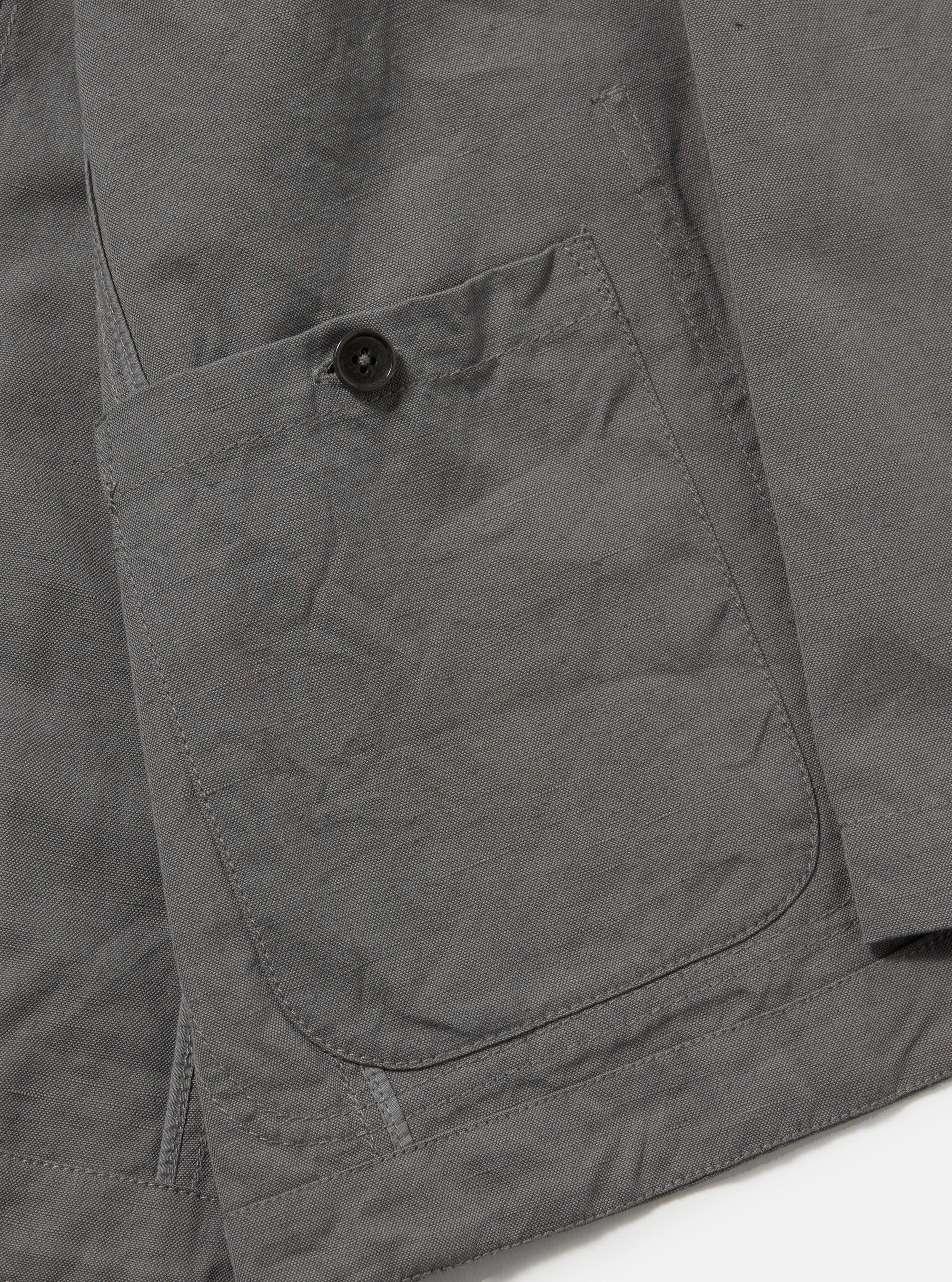 The Mid Grey Linen Slub Weave Bakers Jacket is shown from the back as a flat lay against a white background. The image highlights the center back seam, the structured collar, and the natural, irregular texture of the slubbed linen-cotton blend fabric.
