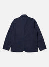 The Navy Linen Slub Weave Bakers Jacket is shown from the back as a flat lay against a plain white background. The image highlights the jacket's textured navy blue linen-cotton blend fabric, featuring a central vertical seam and a straight hem.