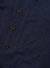 The Navy Linen Slub Weave Bakers Jacket is shown from the back as a flat lay against a plain white background. The image highlights the jacket's textured navy blue linen-cotton blend fabric, featuring a two-piece sleeve construction and a center back vent.