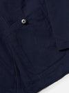 The Navy Linen Slub Weave Bakers Jacket is shown from the back as a flat lay against a plain white background. The image highlights the textured, irregular surface of the navy linen-cotton blend fabric and the jacket's simple, straight-cut rear construction with a single-piece back panel and a clean hem.