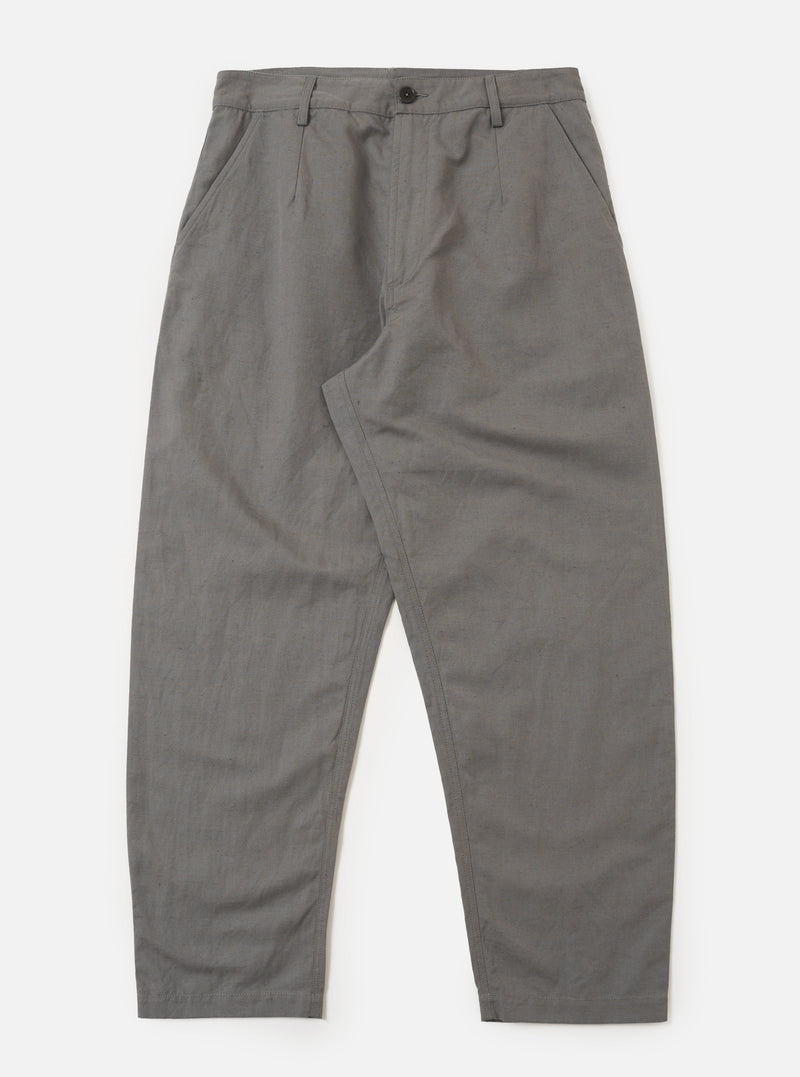 The Mid Grey Linen Slub Weave Dizzy Trouser is presented as a flat lay against a plain white background. The trousers feature a wide-leg, loose silhouette and a structured waistband with belt loops. The mid-grey fabric displays a distinct, textured slub weave.