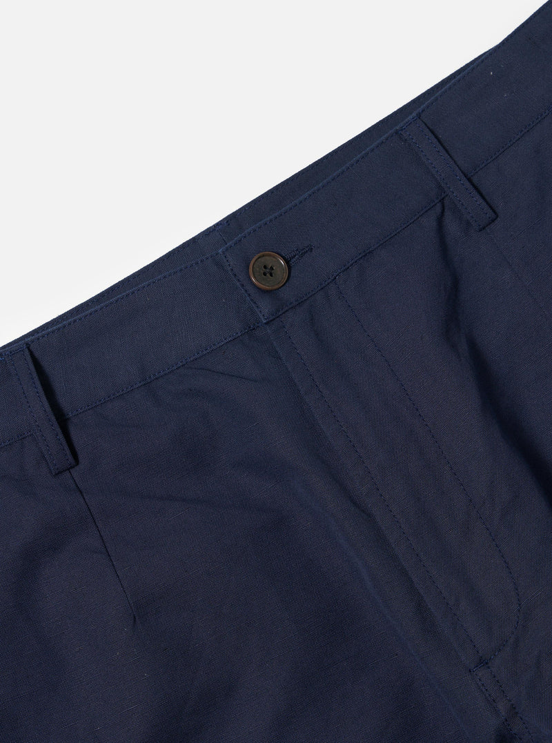 The Navy Linen Slub Weave Dizzy Trouser is shown from the rear, laid flat against a solid white background. The image highlights the wide-leg silhouette, a single rear buttoned flap pocket, and the textured slub weave of the navy fabric.