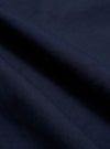 A close-up swatch image of the Navy Linen Slub Weave Dizzy Trouser fabric shows a deep navy blue color with a distinct, irregular slubbed texture. The blend of cotton and linen creates a visible weave with natural variations in the yarn.