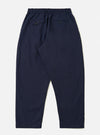The Navy Linen Slub Weave Oxford Pant is shown from a rear angle as a flat lay against a plain white background. The image highlights the two rear patch pockets, the elasticated waistband with a drawstring, and the textured appearance of the navy blue linen-cotton blend fabric.