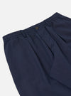 The Navy Linen Slub Weave Oxford Pant is shown from a rear angle as a flat lay against a plain white background. The image highlights the elasticated waistband with visible stitching and a single patch pocket on the right rear side. The fabric is a dark navy linen blend with a distinct irregular slubbed texture.