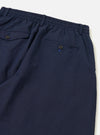 The Navy Linen Slub Weave Oxford Pant is shown from the back as a flat lay against a plain white background. The image highlights the two rear patch pockets and the elasticated drawstring waistband. The navy fabric features a visible textured slub weave throughout.