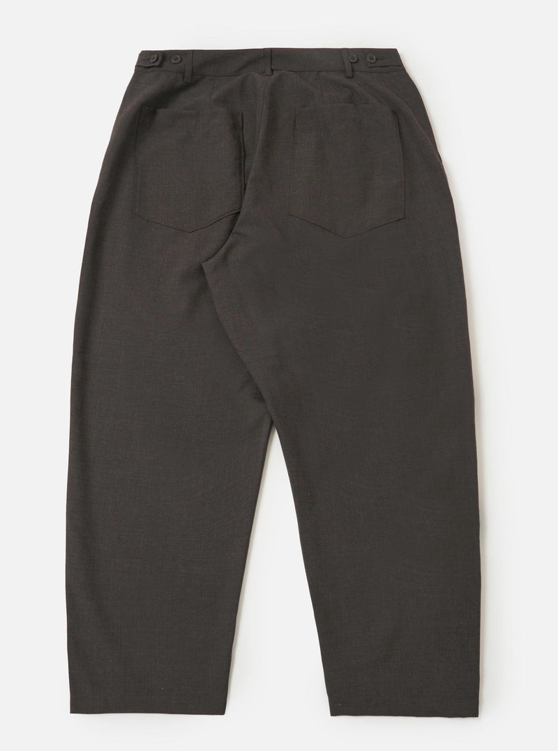 The back of the Brown Marl Tropical Suiting Dutch Pant is shown laid flat against a plain white background. The image highlights the wide-leg cut, two large rear patch pockets, and buttoned waist adjusters on the side.