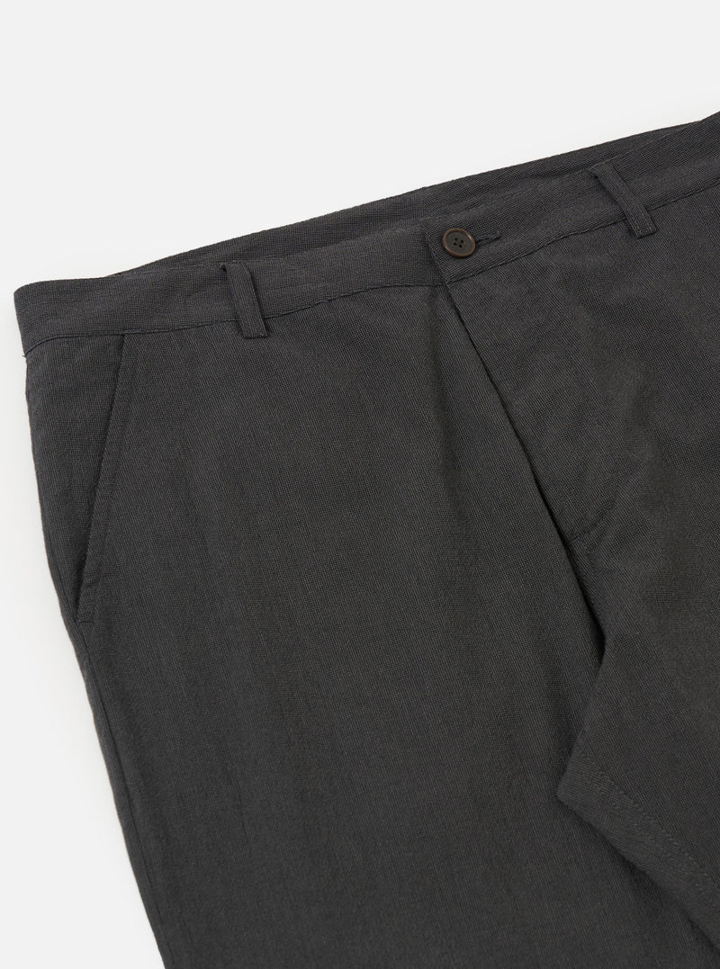 The Charcoal Seattle Cotton Military Chino is shown from a rear perspective, laid flat against a solid white background. The image highlights the two rear buttoned flap pockets and the straight-leg cut of the trousers.