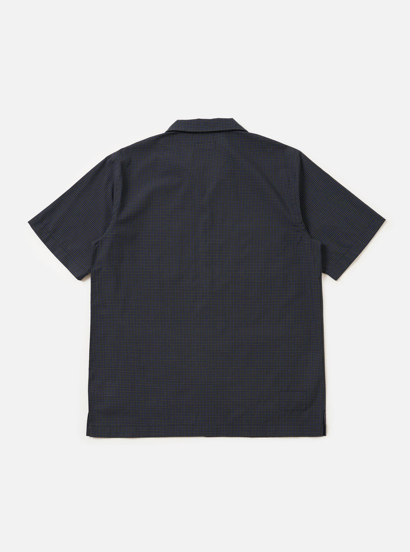 The Navy Check Plaid Summer Overshirt is shown from the back, laid flat against a plain white background. The image highlights the back yoke and the straight hem of the garment.