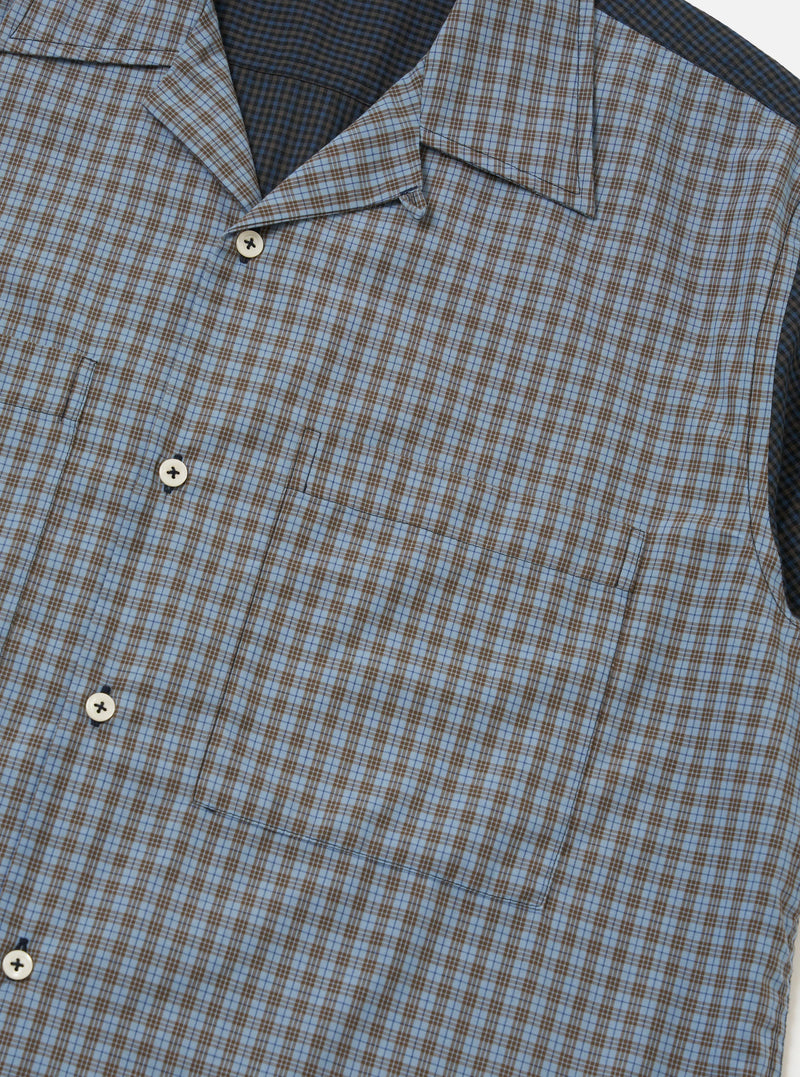 A Mixed Check Plaid Camper Shirt is displayed flat against a plain white background. The garment features a short-sleeve silhouette with a multi-colored patchwork plaid pattern and a camp collar.