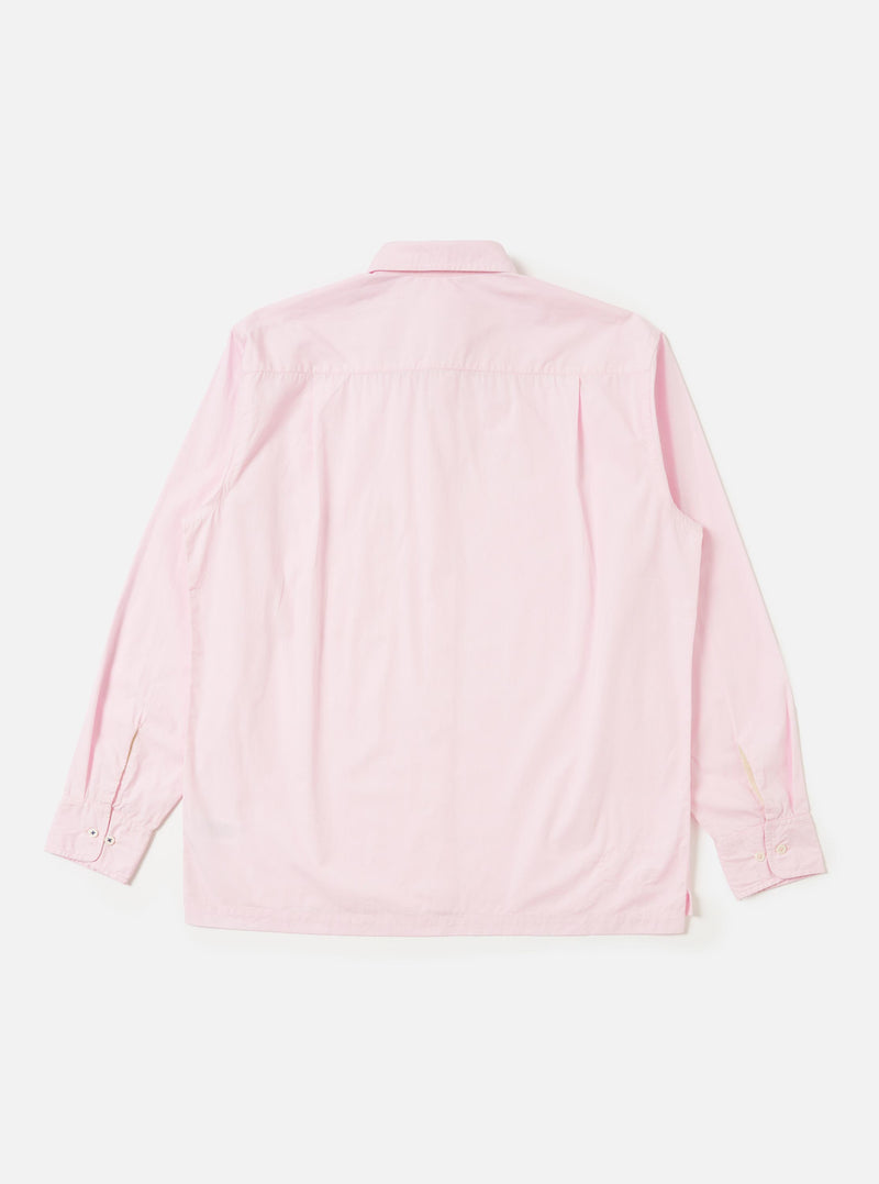 The Pale Pink Broadcloth Lucky Shirt is shown from the back, laid flat against a solid white background. The image highlights the back yoke and a central box pleat designed for a relaxed fit. The lightweight pale pink broadcloth fabric is the prominent feature of the garment.