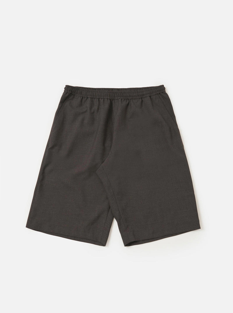 A pair of brown marl tropical suiting vacation shorts is displayed flat against a plain white background. The shorts feature an elasticated waistband with a button closure, side slip pockets, and a relaxed, straight-leg fit.