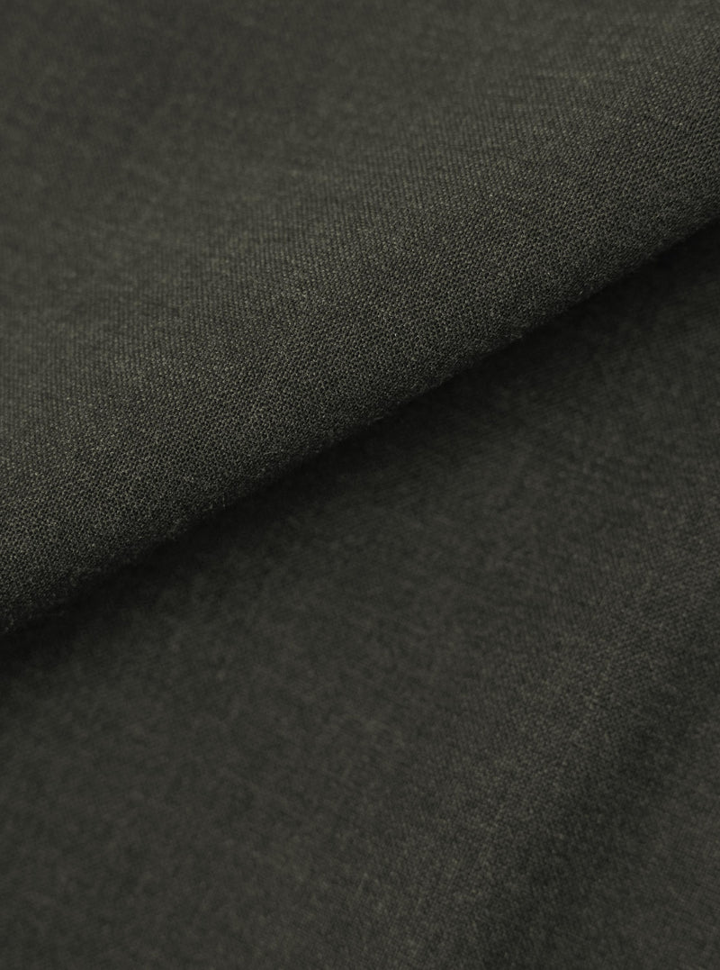 A close-up, square fabric swatch displays the detailed texture and color of the Olive Marl Tropical Suiting Vacation Short. The fabric features a fine, woven marl pattern in shades of olive green.