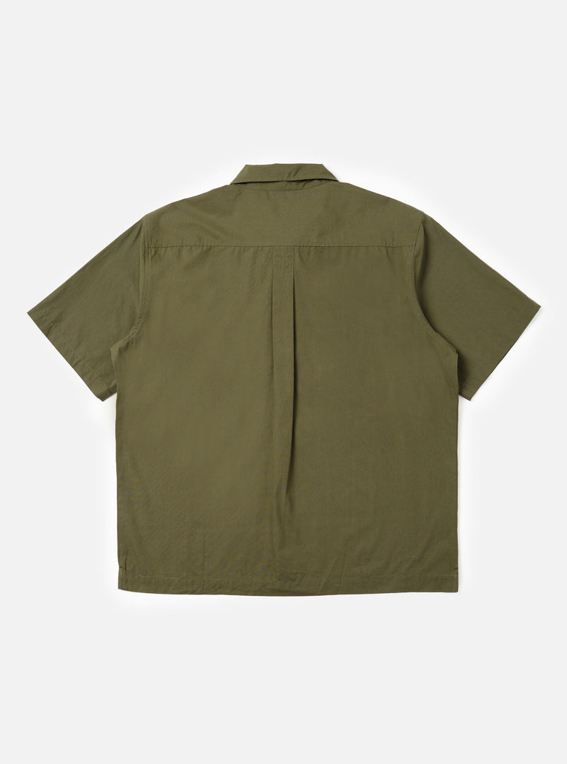 The back of the Olive Broadcloth Ewan Shirt is shown laid flat against a plain white background. The image highlights the short sleeves, a straight hem with small side splits, and a horizontal back yoke with a central box pleat for a relaxed fit.