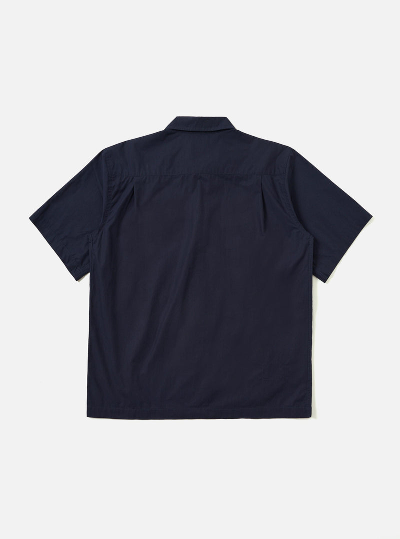 The back of the Navy Paper Touch Cotton S/S Fatigue Shirt is shown from a rear angle, laid flat against a plain white background. The image highlights the short sleeves, a straight hem, and a horizontal yoke across the shoulders.