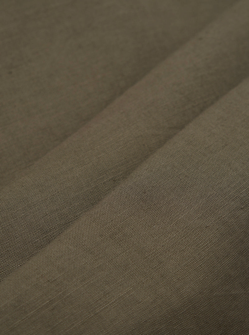 A detailed, close-up fabric swatch of the olive green material used for the Olive Linen Cotton Shirting Camp Shirt. The image highlights the textured weave of the linen-cotton blend fabric.