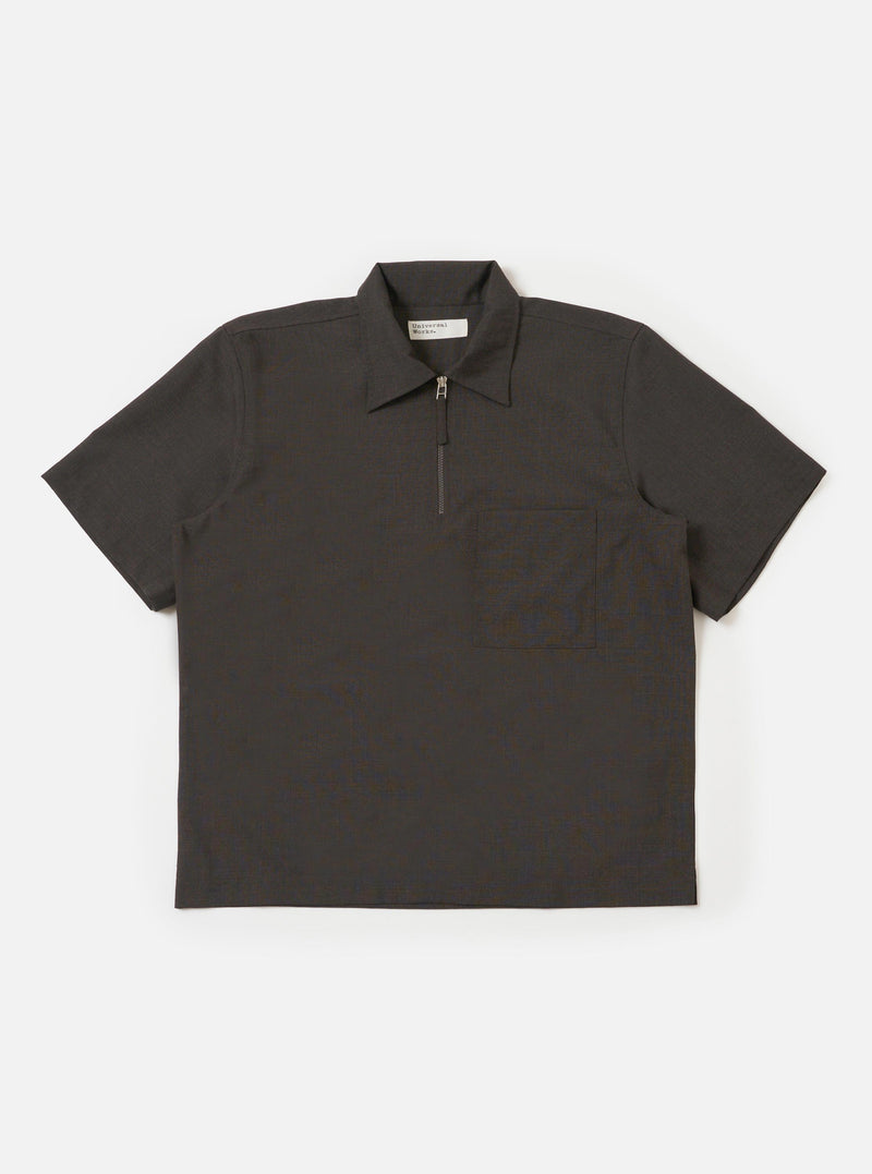 The Brown Marl Tropical Suiting Ewan Shirt is displayed flat against a plain white background. The shirt features a 1/4 zip neck, short sleeves, a classic pointed collar, and a straight hem with side splits. The fabric has a textured brown marl appearance.