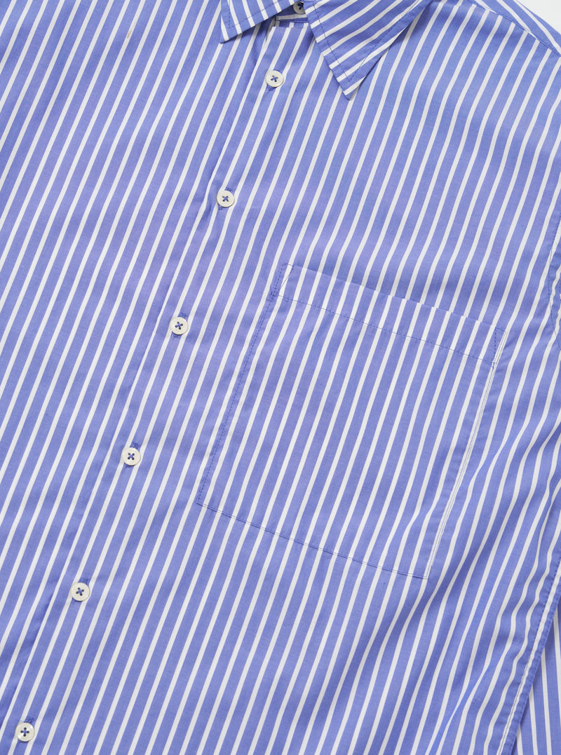 The Blue/White Cotton Stripe Square Pocket Shirt is shown from the back, laid flat against a solid white background. The image highlights the horizontal back yoke and the clean, straight hem of the long-sleeved garment.