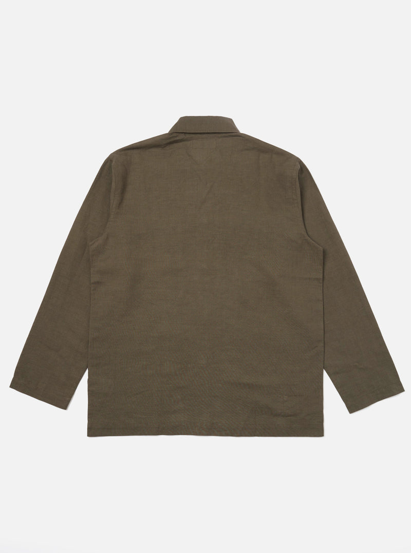 The back of the Olive Linen Cotton Shirting Bakers Overshirt is displayed flat against a solid white background. The image highlights the horizontal back yoke and the clean, straight hemline of the garment.