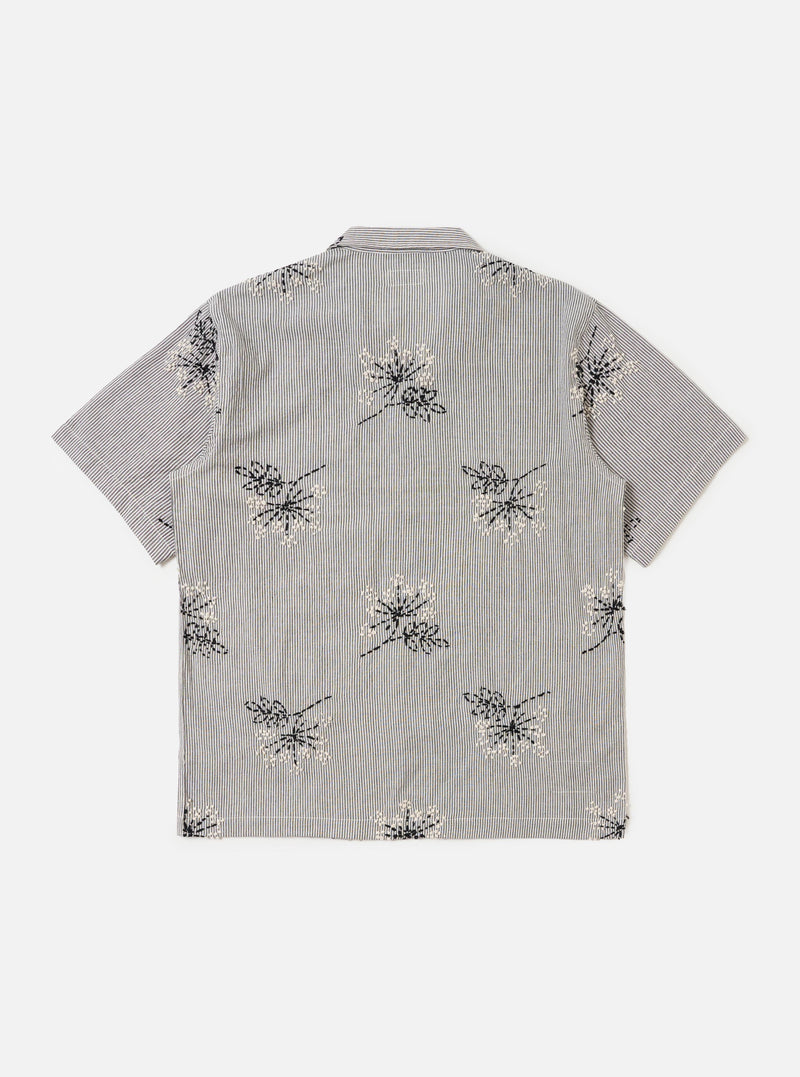 The Grey Hand Embroidered Stripe Cotton Road Shirt is shown from the back, displayed flat against a plain white background. The image highlights the short sleeves, a straight hem, and the subtle vertical stripe pattern of the grey cotton fabric.