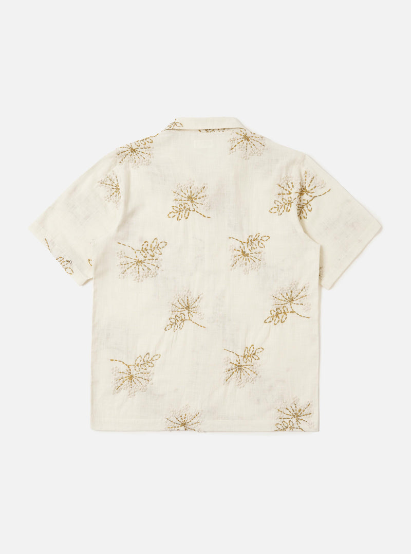 The Ecru Hand Embroidered Cotton Road Shirt is displayed from the back, laid flat against a solid white background. The shirt features a light ecru base with subtle vertical stripes and small hand-embroidered floral motifs. A clean back yoke and a straight hem are the prominent features of this view.