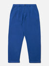 Paraboot x Universal Works Navy Derek Twill Super Chino on a white background. The chinos are a vibrant navy blue, made of twill, and have a relaxed fit with cuffed hems.