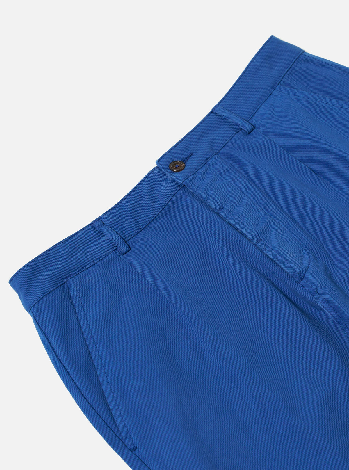 Close-up of the Navy Derek Twill Super Chino on a white background. The twill fabric shows a subtle texture. The fit looks modern and comfortable.