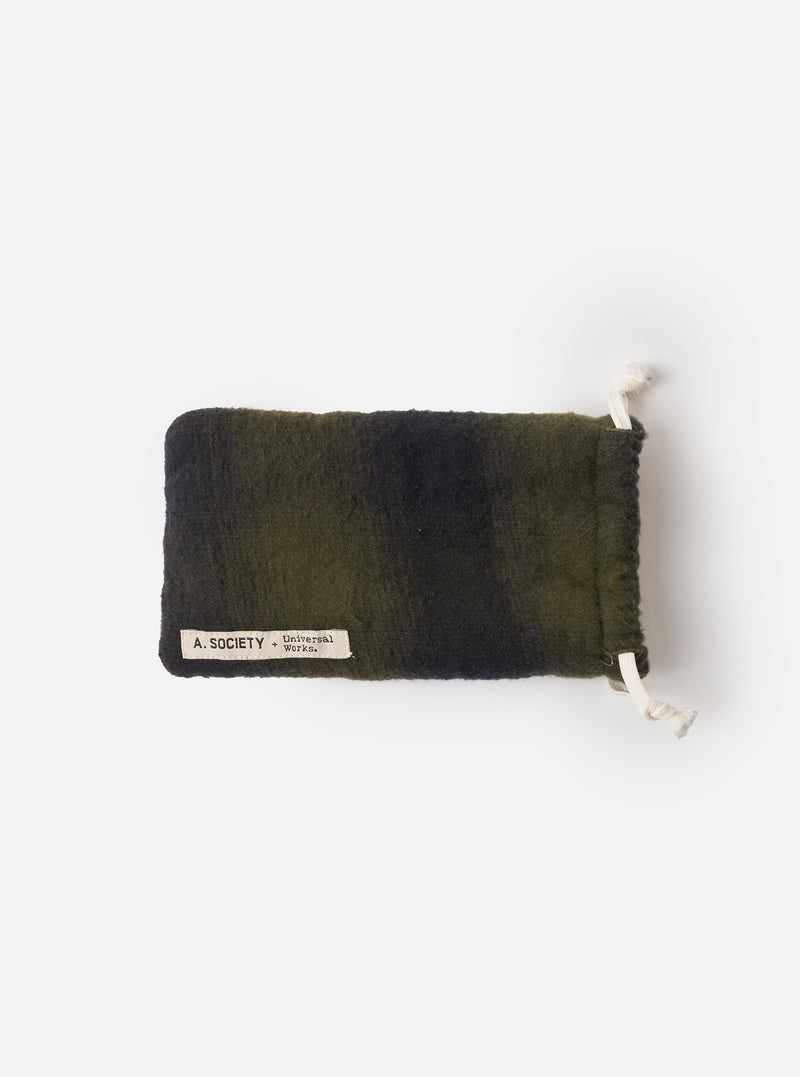 Product photograph of the A. SOCIETY x Universal Works Grey Havana Hollywood Sunglasses set on an olive fabric pouch over a plain white background, highlighting the grey Havana pattern.