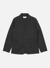 The Black Twill London Jacket is displayed on a white background. The jacket has a three-button closure and two large patch pockets.