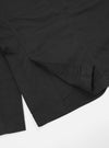 Close up of the Black Twill London Jacket on a white background, showing the texture and construction details.