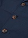 Close-up of the Navy Twill London Jacket showing the navy twill material and brown buttons. The jacket is neatly staged.