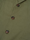 Close-up of the Light Olive Twill London Jacket, showcasing its twill texture and button details. The jacket is displayed on a flat surface.