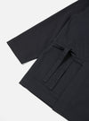 Close-up of the Black Twill Kyoto Work Jacket on a white background. Features include a tie, pockets, and twill fabric.