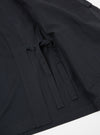 Close-up of the Black Twill Kyoto Work Jacket on a white surface. The jacket features a tie closure and visible stitching.